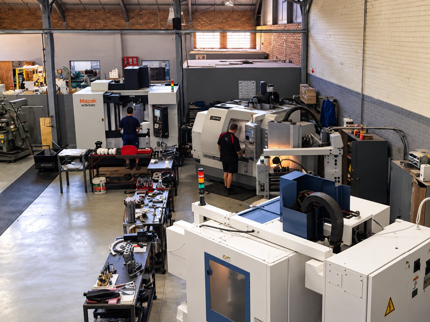 Mazak and Okuma CNC cells running on the Kobot shop floor